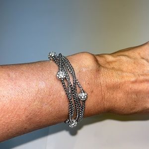 EUC: silver bracelet made up of five smaller silver chains with rhinestone beads